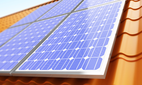 A house featuring solar panels on its roof, showcasing sustainable energy solutions.