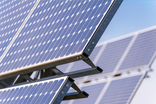 Solar panels arranged on a residential roof, promoting sustainable energy use and reducing carbon footprint.