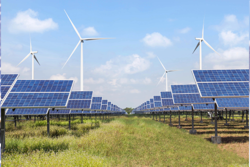 Solar panels and wind turbines are installed in a field, highlighting the integration of renewable energy technologies.